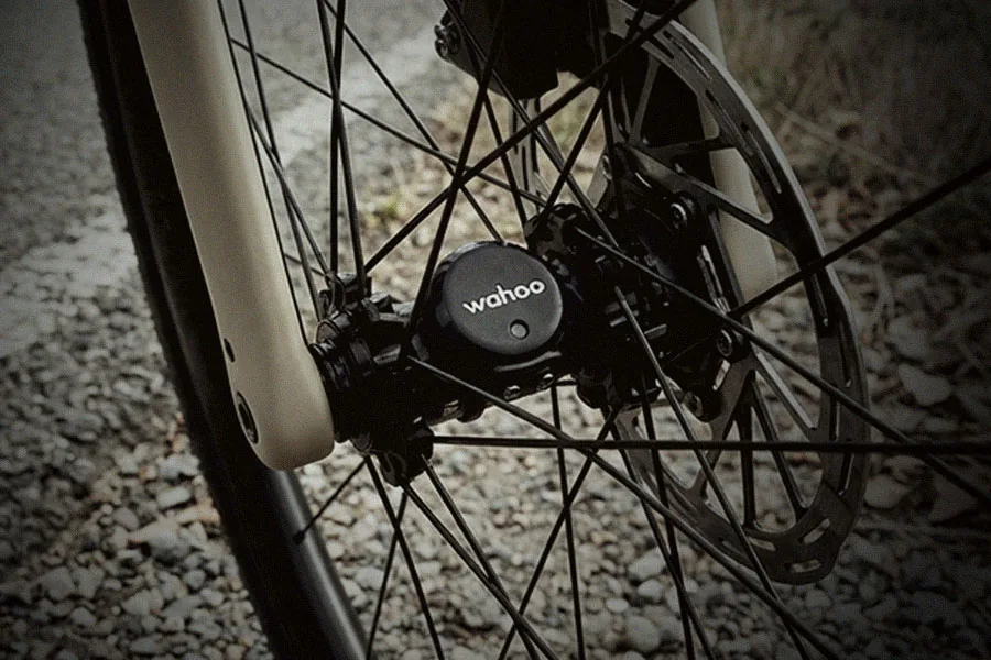 Wahoo speed sensor attached to a bicycle wheel hub
